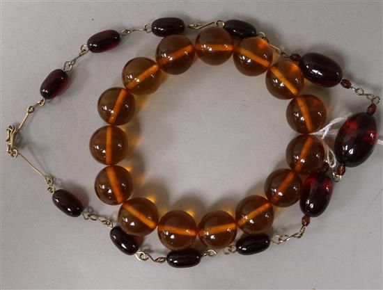 Two simulated amber bracelets.